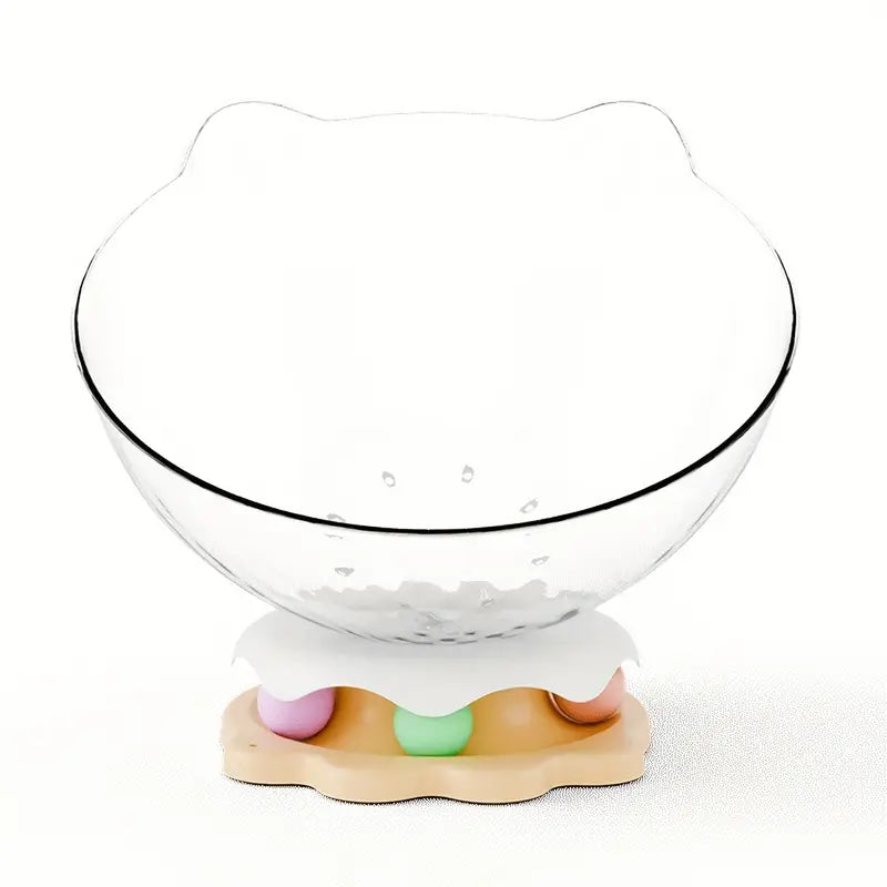An acrylic capsule-shaped cat bowl, with a track ball which is placed on a white background