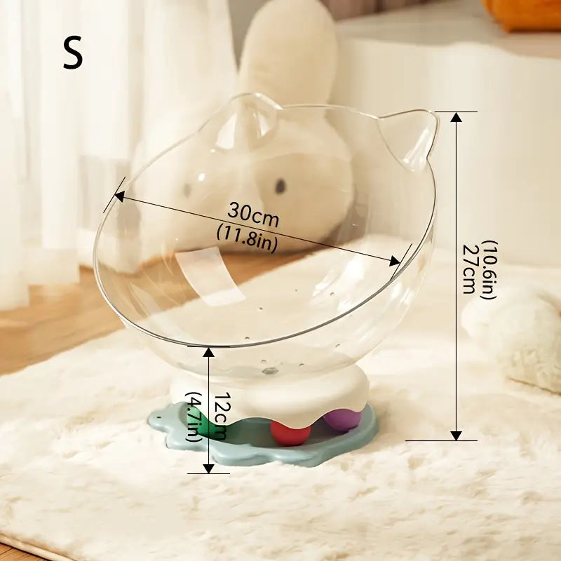 An acrylic capsule-shaped cat bowl, with a track ball which is placed on a white background with measurements