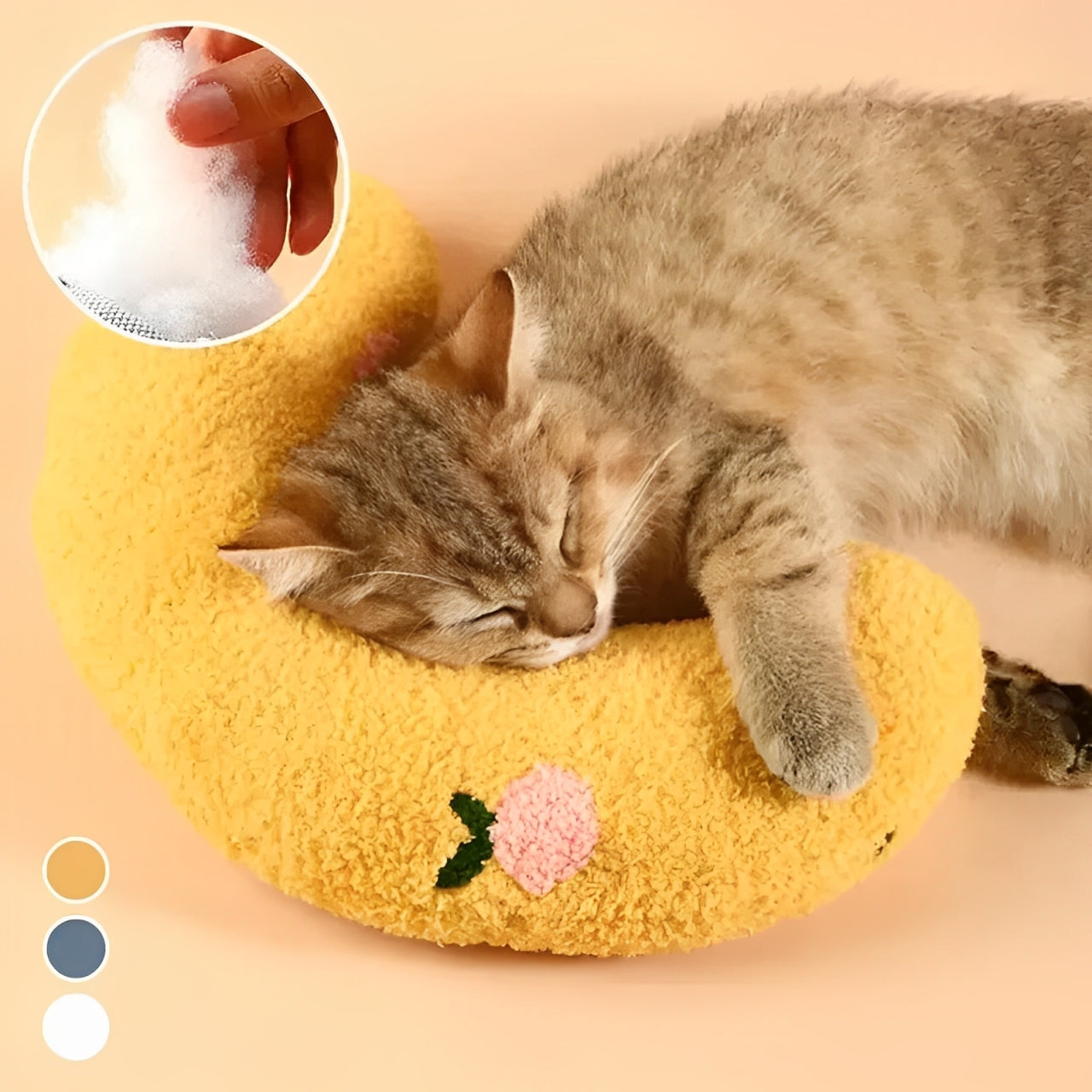 A cat resting its head on a yellow U-shaped cat hugging pillow