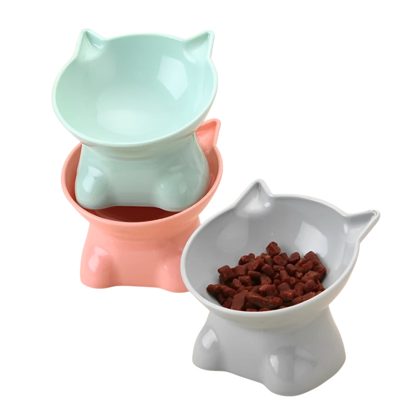 Three pet bowls in different colors with one filled with food on a white background