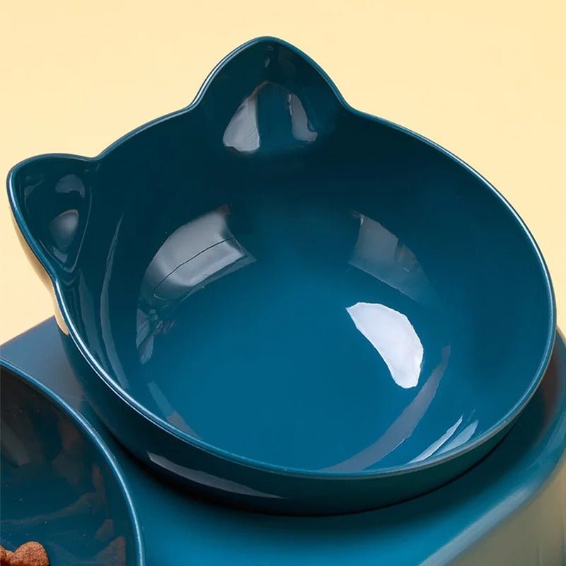 Blue ceramic cat-shaped bowl on a beige background
