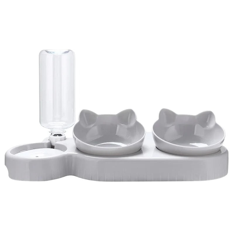 White pet feeding station with two bowls and a water bottle on a white background