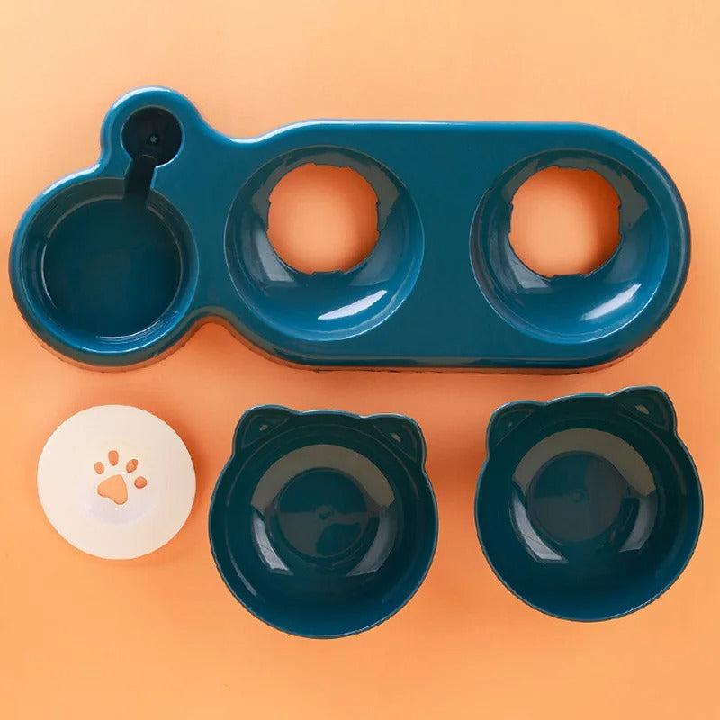 Blue pet bowl set with two bowls and a lid on an orange background