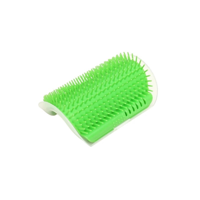 Green pet grooming brush on a white background
