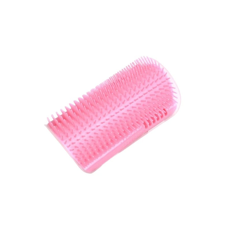 Pink cat grooming brush on a white background