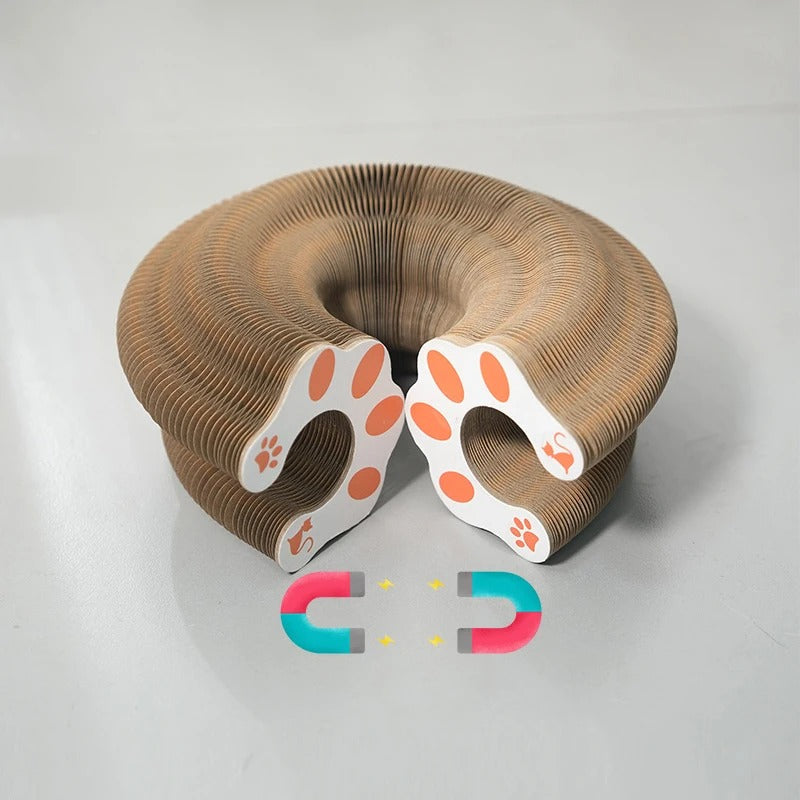 Cardboard cat scratcher toy with paw pattern on a gray background