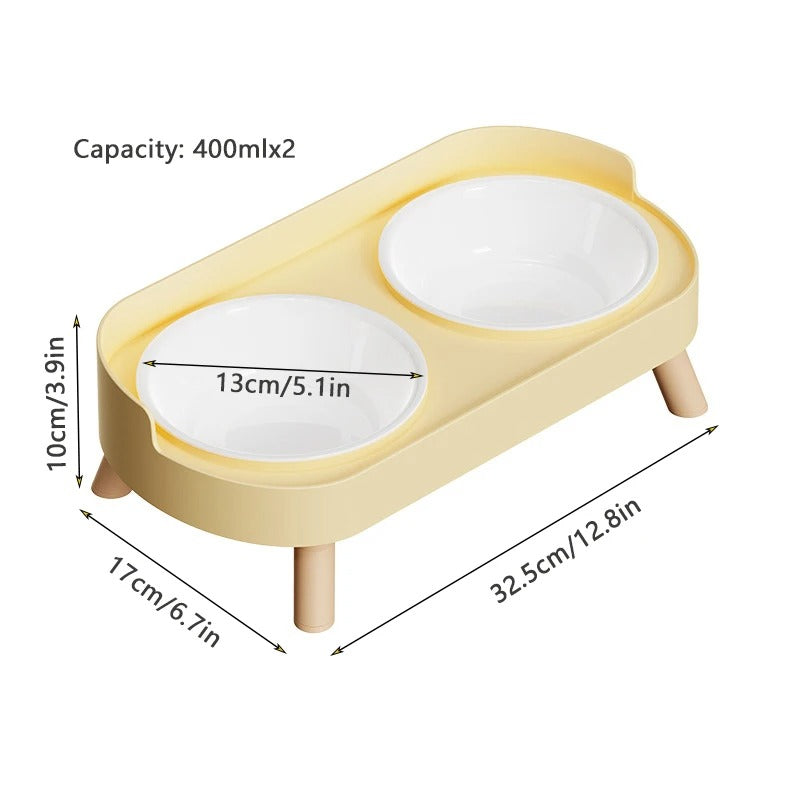 Yellow pet feeder with two white bowls and dimensions on a white background