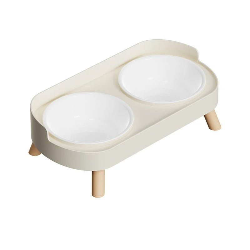 Beige and white cat feeder with two bowls on a white background