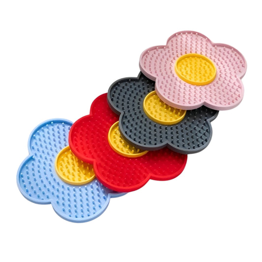 Set of colorful flower-shaped cat lick mat on a white background.