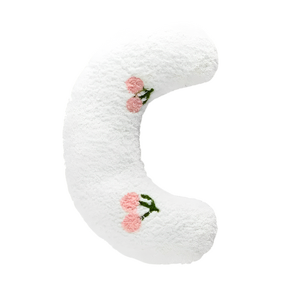 A white U-shaped cat hugging pillow 