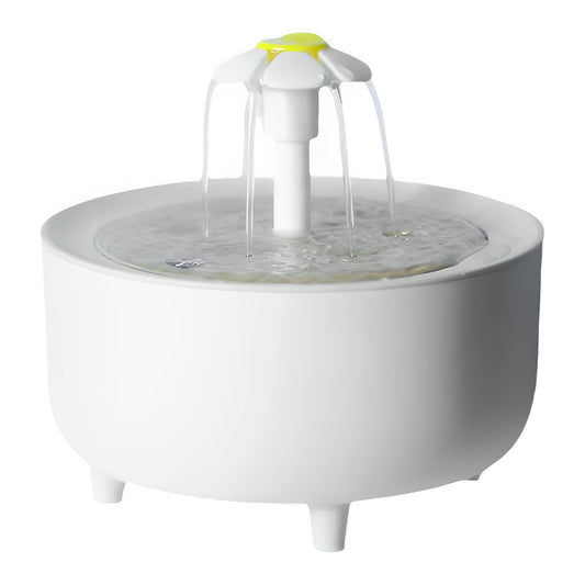 A white cat water fountain with a flowing water design and a yellow flower-like structure on the pump.