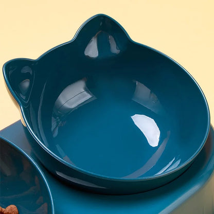 Blue ceramic cat-shaped bowl on a beige background