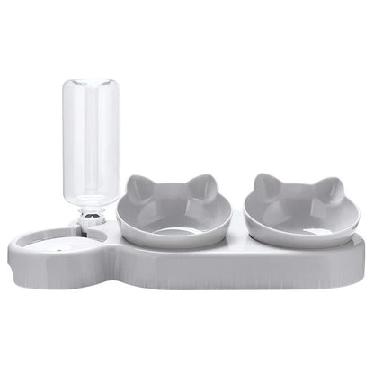 White pet feeding station with two bowls and a water bottle on a white background