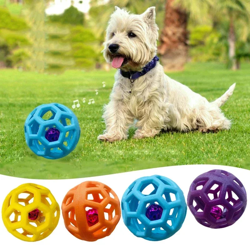 Dog playing with a blue ball on grass, with additional colorful balls displayed below.