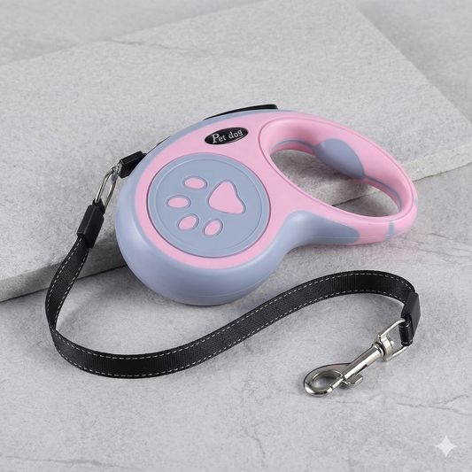 Retractable dog leash with pink and gray design on a light gray background