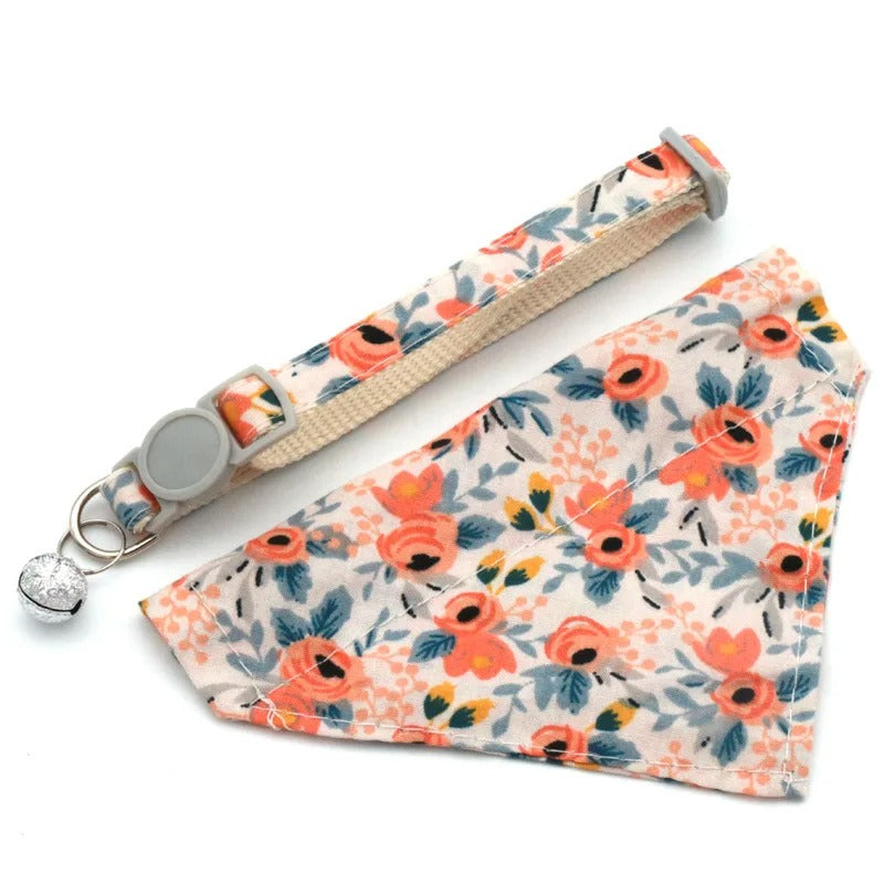 Floral patterned dog collar and bandana set on a white background