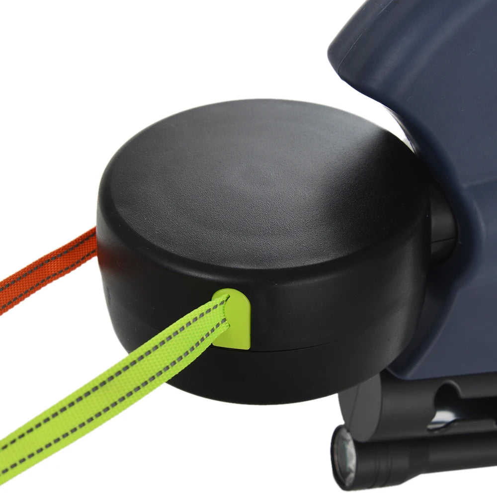 Close-up of a black leash with a green strap attached on a white background