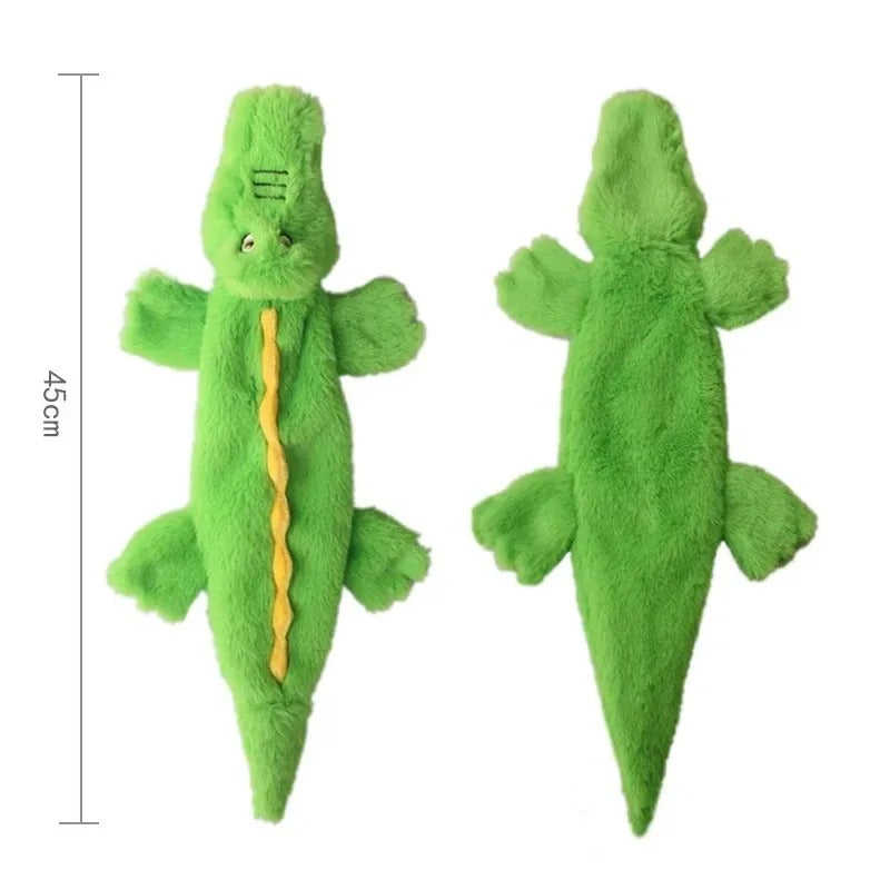 Green plush toy resembling a lizard with measurements on a white background