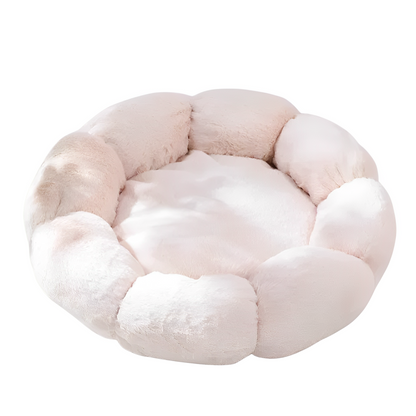A beige flower-shaped plush soft bed on a white background.