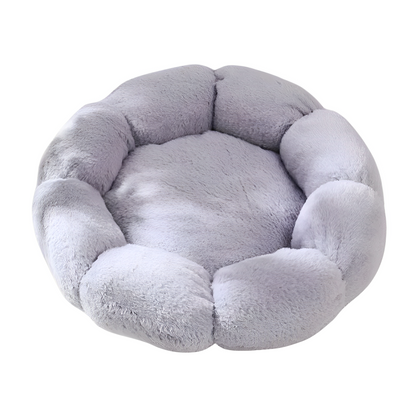 A grey flower-shaped plush soft bed on a white background.