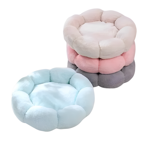Stack of round cat nests in pink, gray, and blue colors, each adorned with a floral pattern.