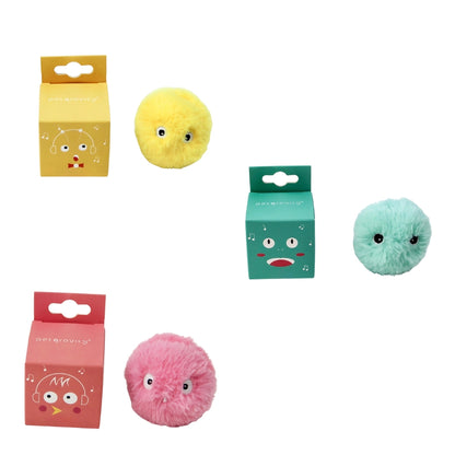 Three colorful plush balls with facial expressions in front of their packaging on a white background