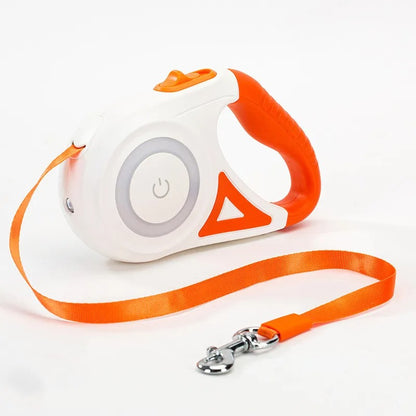 White and orange retractable dog leash with a power button on a white background