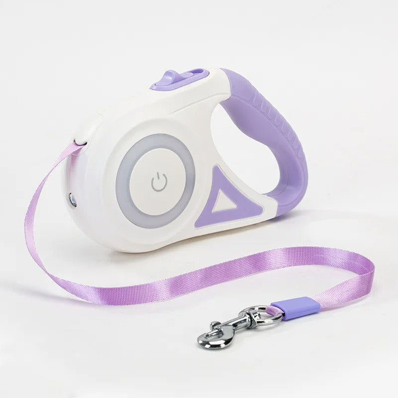 Retractable dog leash with white handle and purple accents on a light gray background
