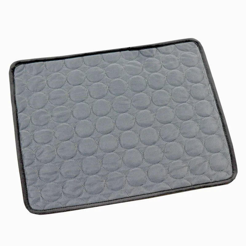 Dark grey cooling mat in a white background