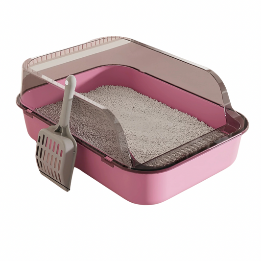 A pink cat litter tray with an open top and a gray scoop, filled with cat litter.