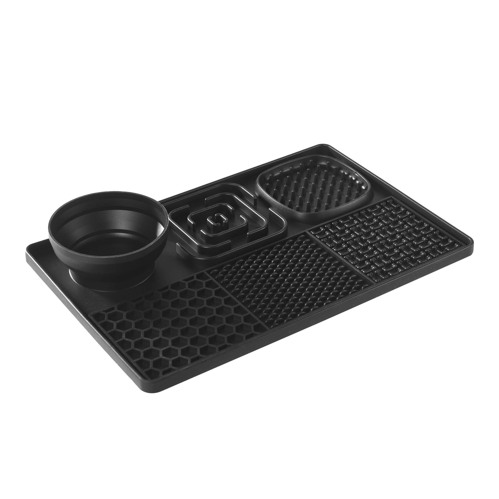 Black silicone mat with various compartments on a white background