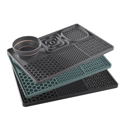 Set of three gray silicone mats with different patterns on a white background
