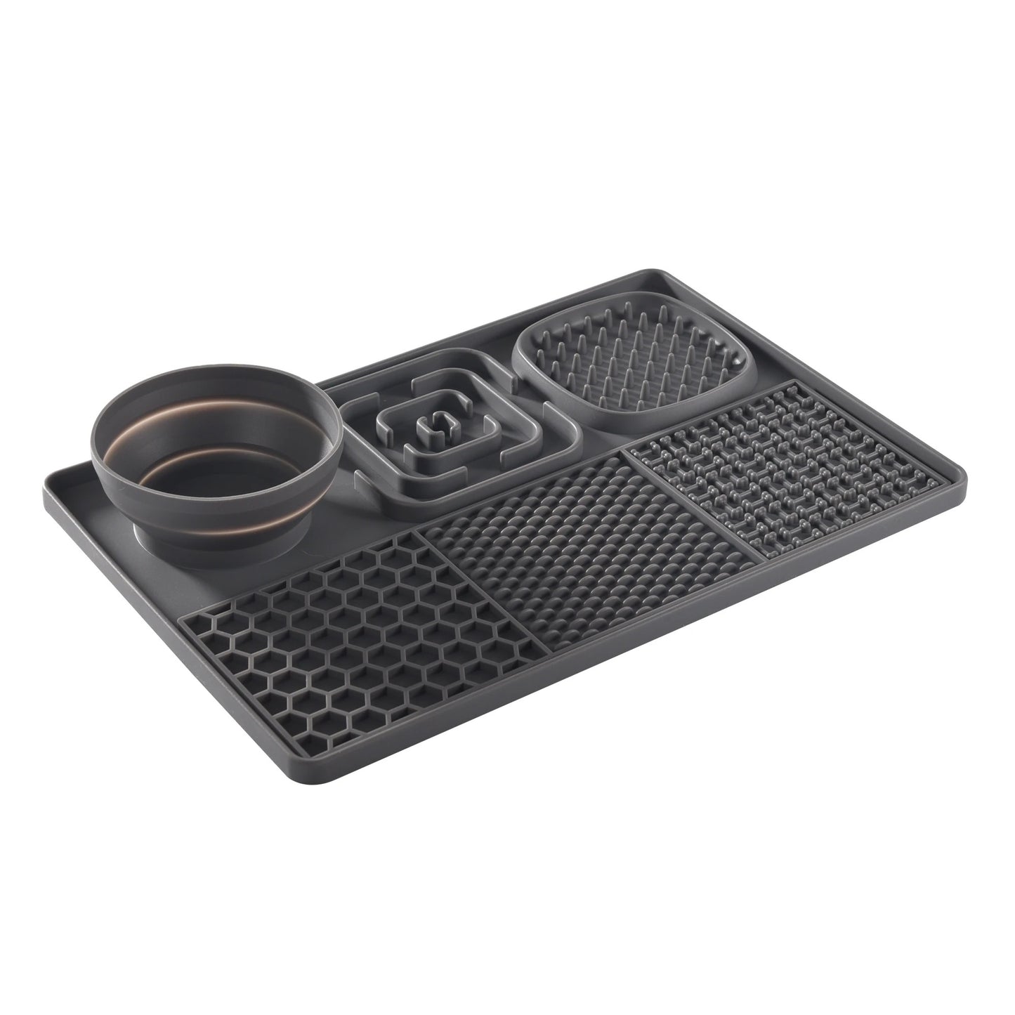 Black silicone mat with various compartments on a white background