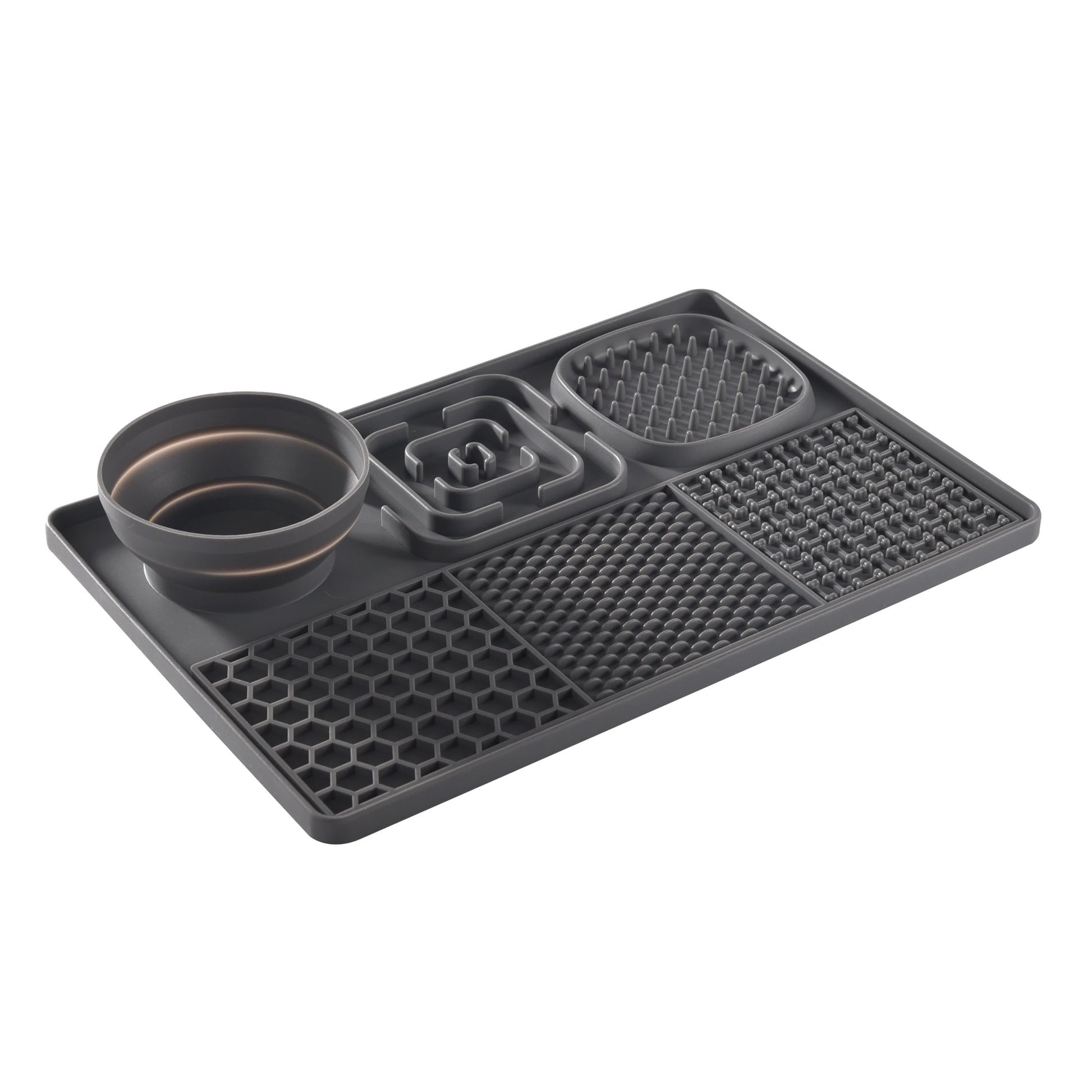Black silicone mat with various compartments on a white background
