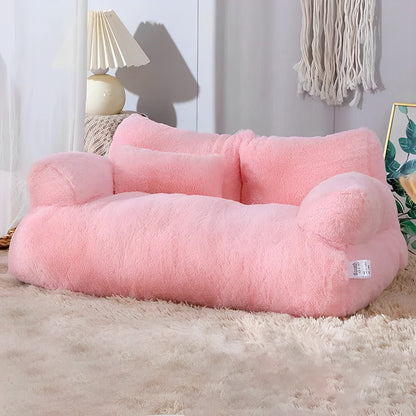 Pink plush cat sofa in a living room background.