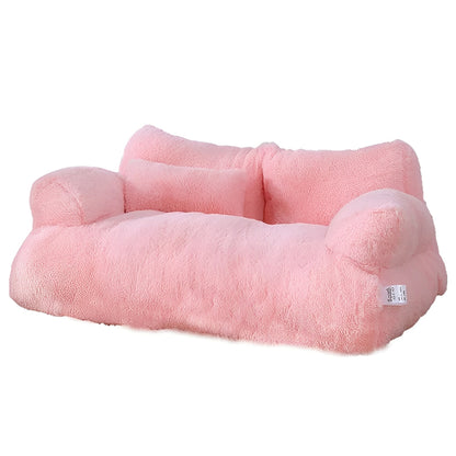 Pink plush cat sofa in a white background.