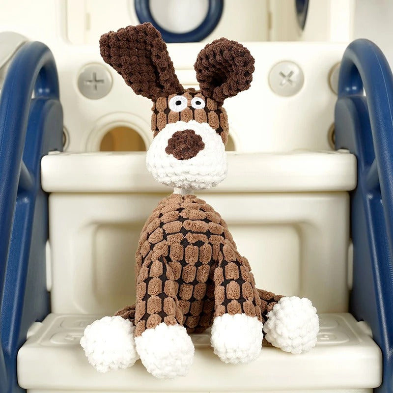 Knitted dog toy sitting on a plastic chair with a white background