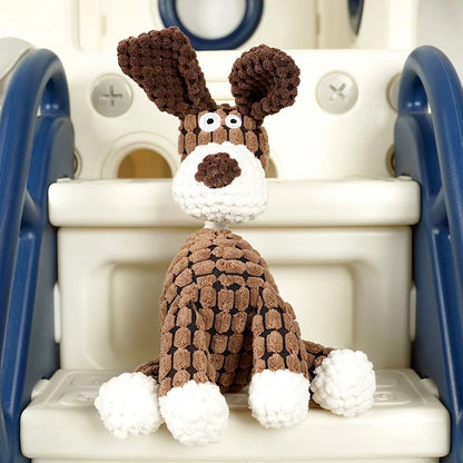 Knitted dog toy sitting on a plastic chair with a white background