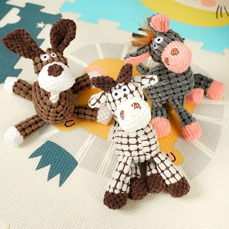 Three knitted animal toys on a colorful surface