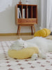 A video of a cat resting its head on a U-shaped cat hugging pillow 